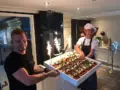 Crew presenting cake