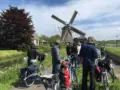 Kinderdijk windmill cyclists